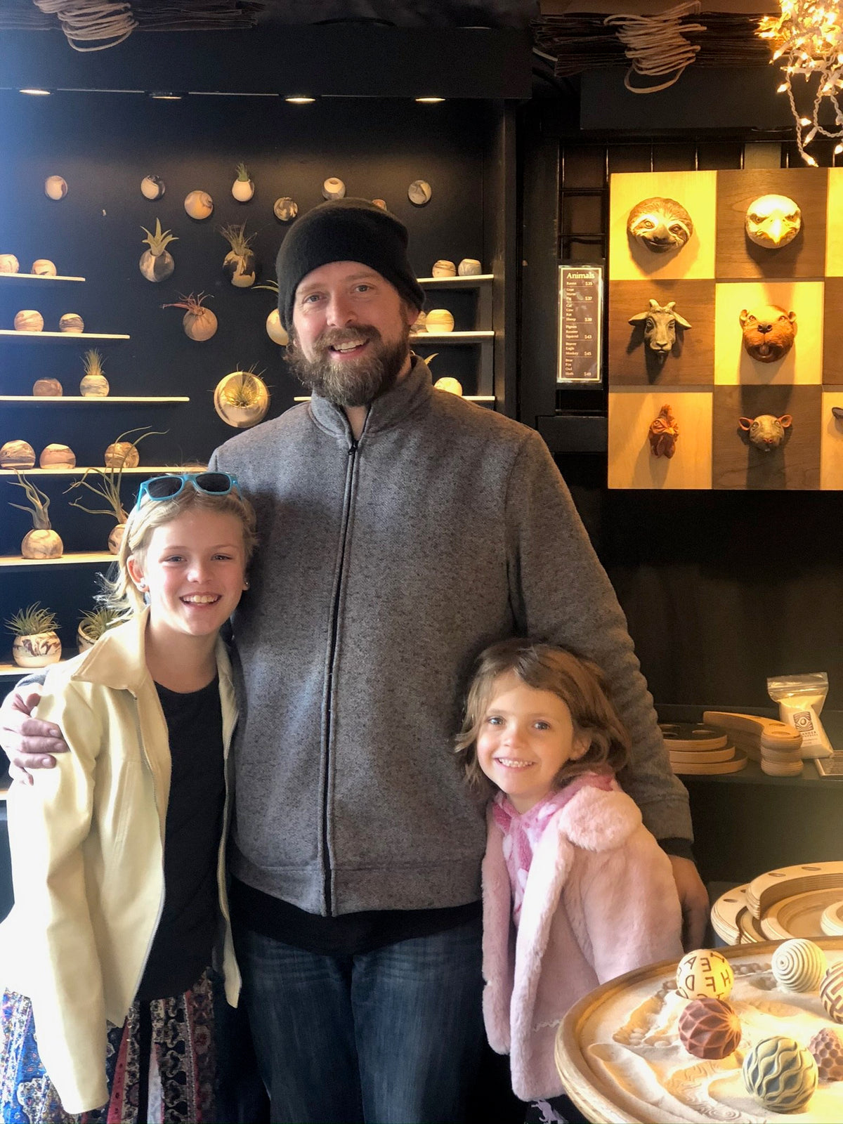 Andrew Lonnquist and his two daughters at an Olander Earthworks display