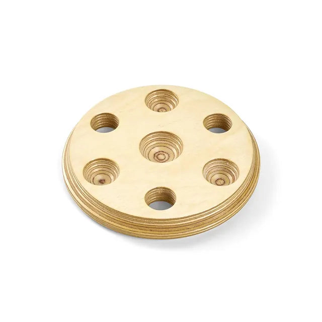 A natural wood 7-inch Wonderscape tray cover with round openings for Sand Spheres.