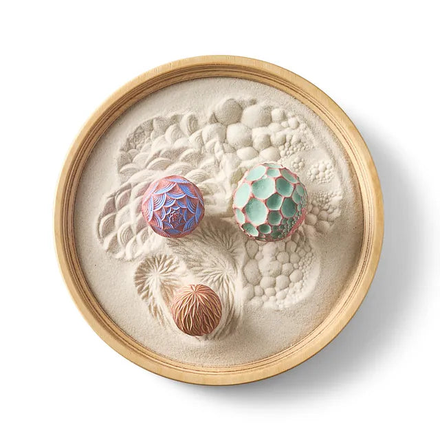 Easy Breezy Wonderscape from above: a birch Mini tray of patterned sand with three textured Sand Spheres.